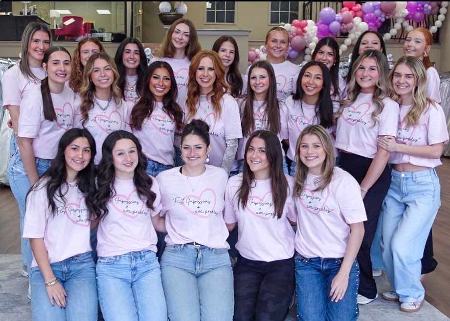 Team photo of the staff and owner of Ultra Tan at First Impressions.